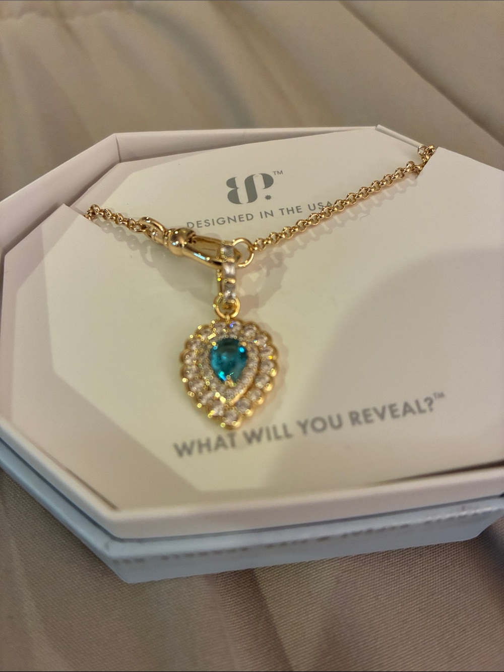 Gold Heart Pendant Necklace with Blue Teardrop Stone